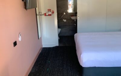 Accessible Accommodation Moorabbin - Sandbelt Club Hotel with step free shower, wall mounted shower chair and step free access.